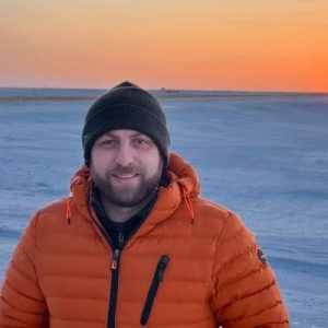 Photo of person near ocean