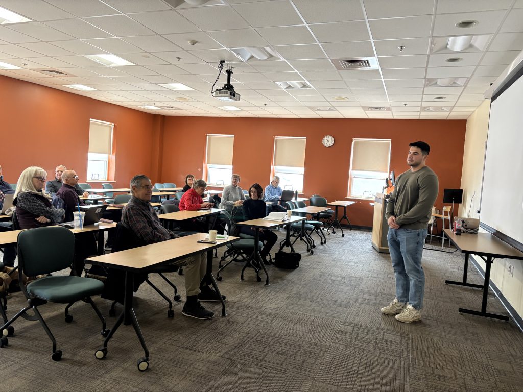 photo of anthony pellicone in front of a classroom of adult learners