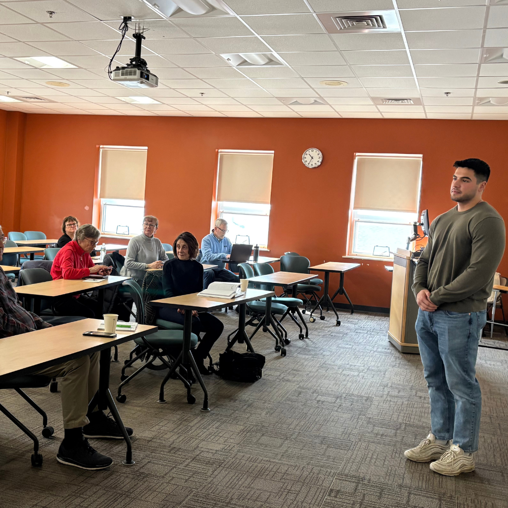 photo of anthany pellicone in front of a classroom of adult learners